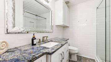 Shower, hair dryer, towels, shampoo