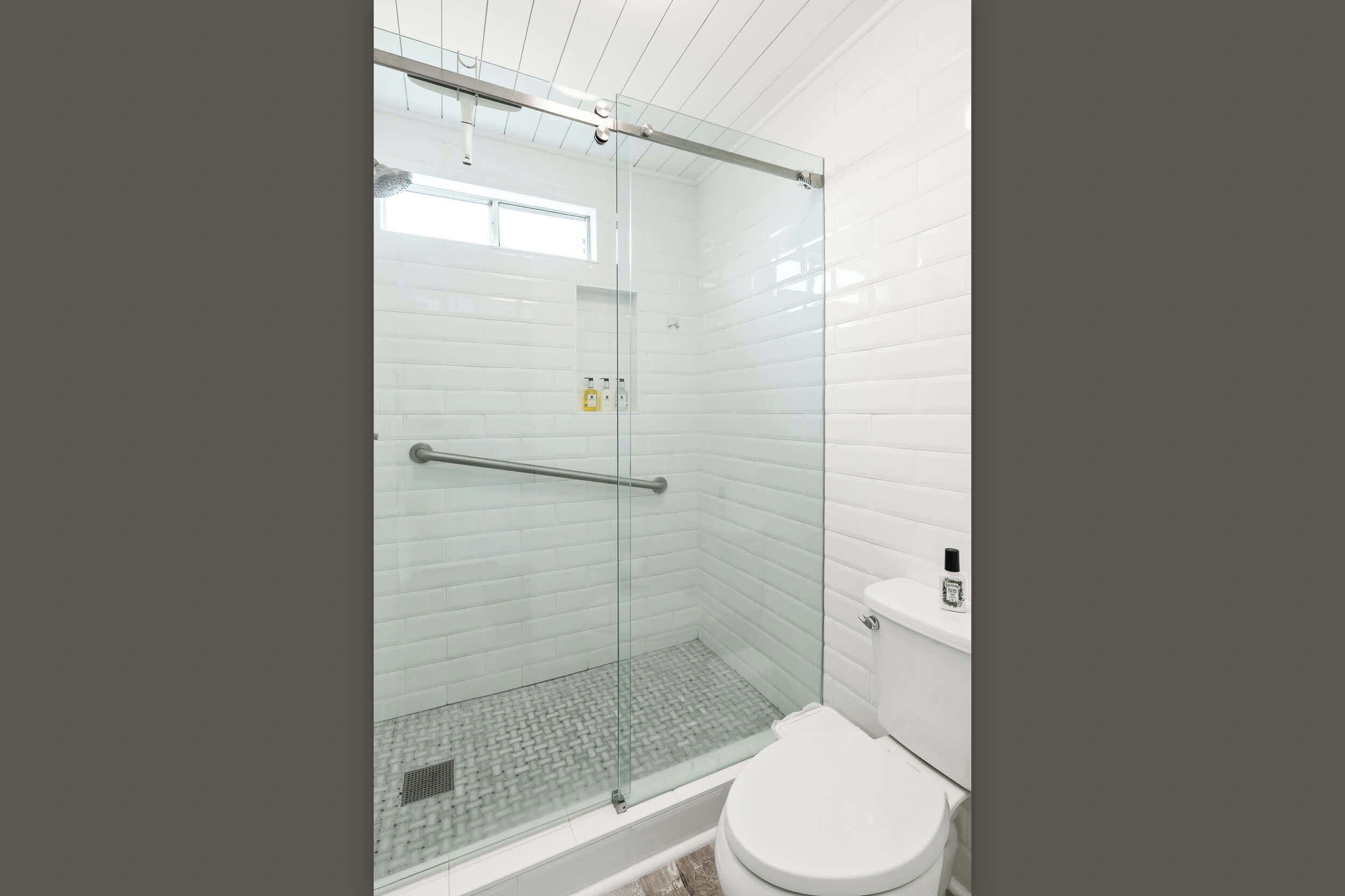 Shower, hair dryer, towels, shampoo