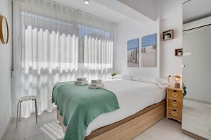 Appartement | 2 chambres, ameublement personnalisé, fer et planche à repasser