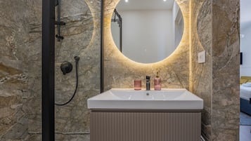 Triple Room, City View | Bathroom | Shower, hair dryer, towels, soap