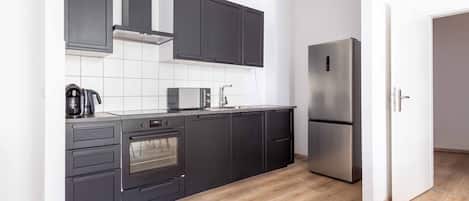 Fridge, microwave, stovetop, coffee/tea maker