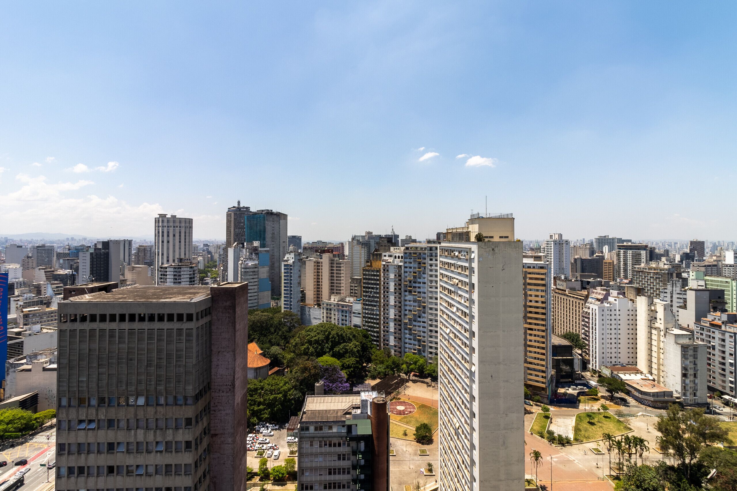 A high-rise urban area with multiple buildings, including a prominent tall structure in the foreground.