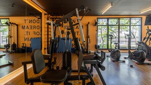 A gym with exercise equipment, large windows, and a mirror. - Ycp704 in S o Paulo (São Paulo)