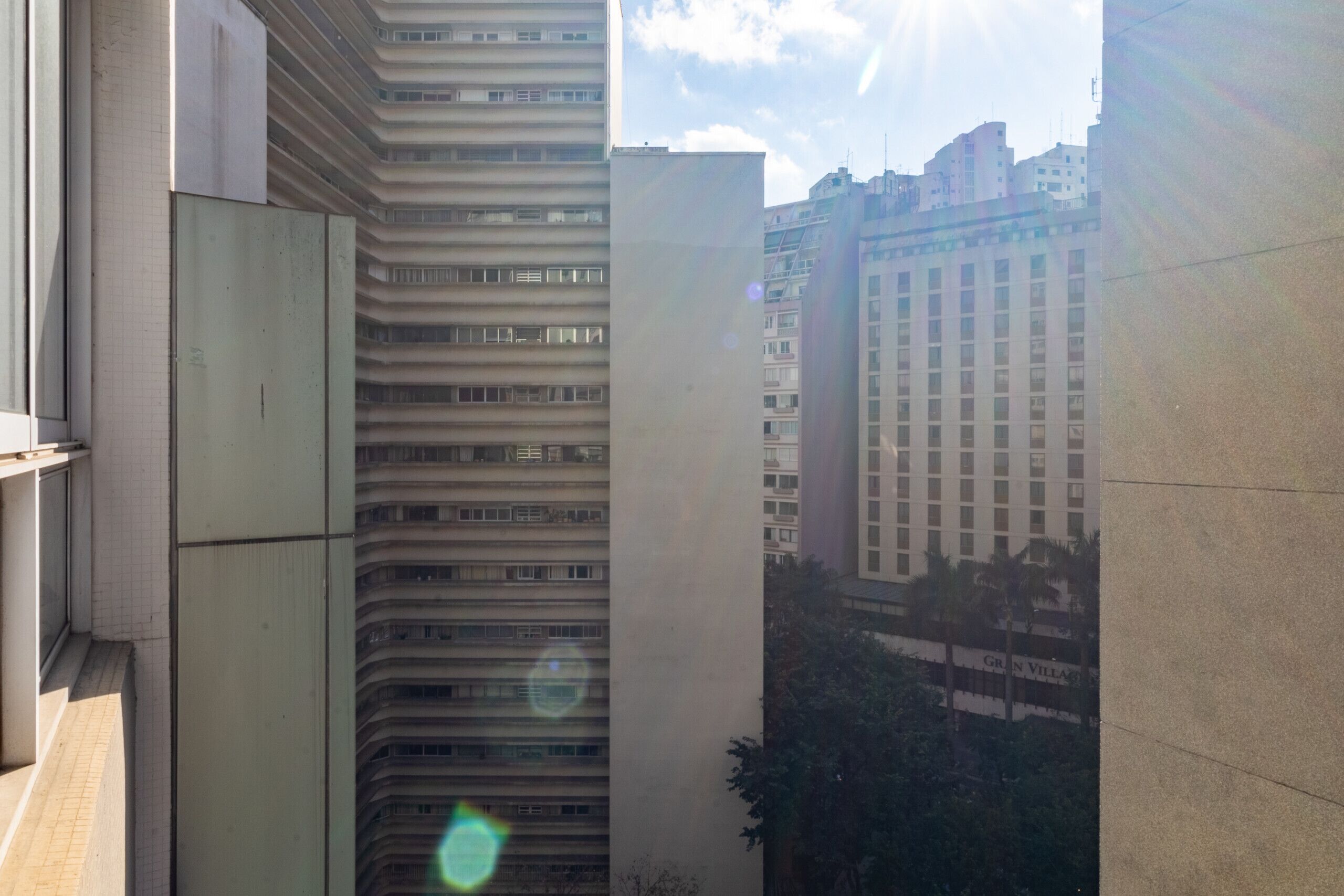 A high-rise building with multiple floors and balconies.