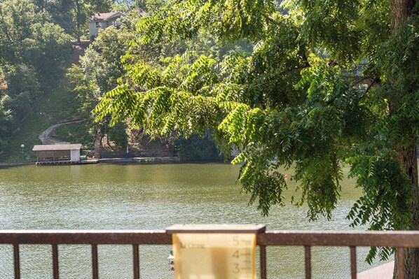 A river with a bridge, a small building, and dense foliage. - Highlands Lakeside Retreat, On Loch Lomond (Bella Vista)