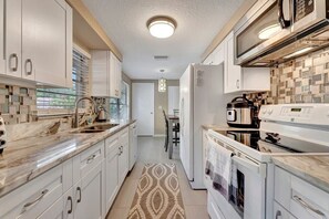 Fridge, microwave, oven, stovetop - Coastal 2BR | Pet-Friendly • Near Sunset Beach (Tarpon Springs)