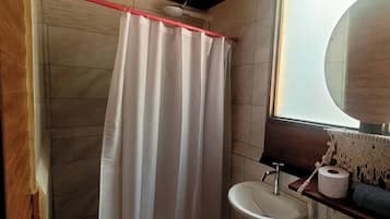 Shower, towels, soap, toilet paper