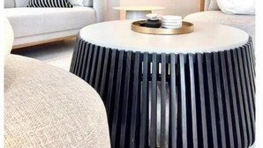 A modern living room with a round coffee table, a sofa, and a bookshelf. - New luxury 1bd - Gated - Pool,  Beach and Gym access - Quiet and Relaxing (Nassau)