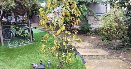 Gîte urbano con jardín arbolado