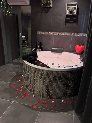 Jetted bath, hair dryer, towels, soap