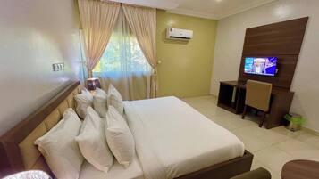 Economy Room, Balcony, City View | Desk, laptop workspace, blackout drapes, soundproofing