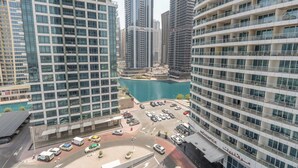 A high-rise building with a central courtyard and a marina.