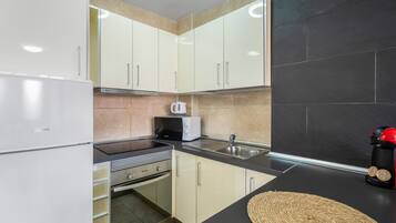 Fridge, microwave, stovetop, coffee/tea maker