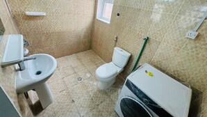 A bathroom with a toilet, bidet, and sink. - Private Studio attach washroom, kitchen, Terrace (Abu Dhabi)