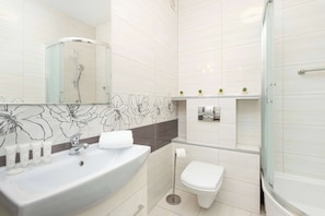 Shower, hair dryer, towels, shampoo