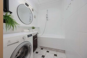 Shower, hair dryer, towels, shampoo