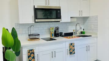 Fridge, microwave, stovetop, coffee/tea maker
