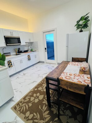 Fridge, microwave, stovetop, coffee/tea maker