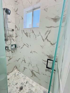 Shower, hair dryer, towels, soap