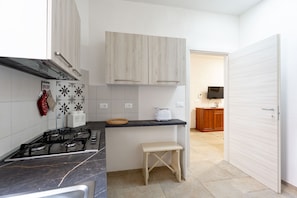 Fridge, dishwasher, coffee/tea maker, dining tables