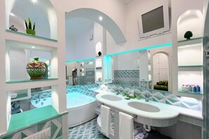 Shower, jetted bath, bidet, towels