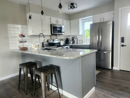 Microwave, oven, stovetop, dishwasher. A Spacious Townhome in Newton - Unit D