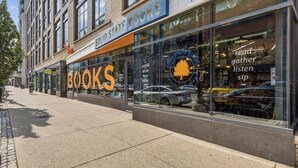 A storefront with a large 'BOOKS' sign and a 'SOLID STATE BOOKS' sign above it. - Private 1 Bedroom/1Bathroom Apartment in Heart of DC! (Washington)
