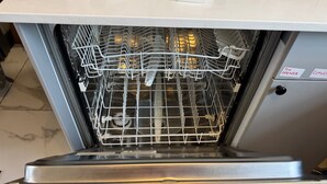 An open dishwasher with a control panel and a label indicating "TUN OPENER" and "CUTLER". - Daisy Haven in Southampton (Southampton)