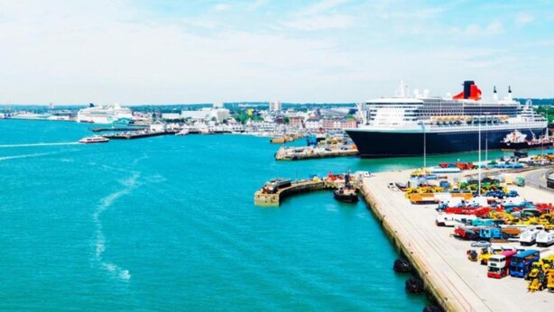 A cruise ship docked at a port with a pier and a marina. - Daisy Haven in Southampton (Southampton)
