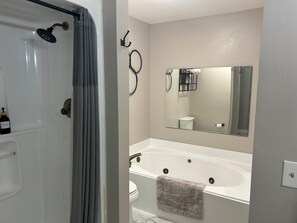 Jetted bath, hair dryer, towels, soap
