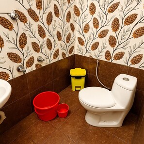 Toalhas de banho, sabonete, papel higiênico