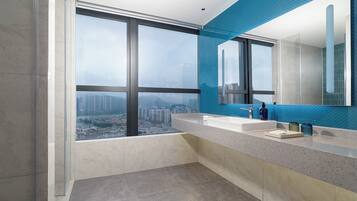 Shower, designer toiletries, hair dryer, slippers