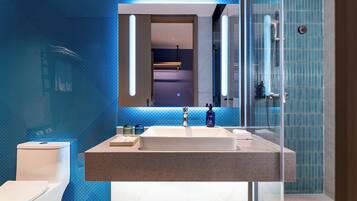 Shower, designer toiletries, hair dryer, slippers