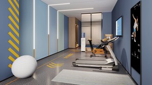 A modern fitness room with a treadmill, exercise ball, and a large poster on the wall. - Holiday Inn Express Quanzhou Fuqiao by IHG (Quanzhou)