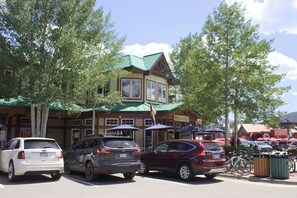 A building with a green roof, multiple windows, and a sign that reads 'BREAD+SALT'.
