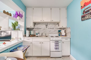 Fridge, microwave, stovetop, coffee/tea maker