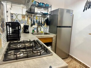 Fridge, microwave, stovetop, coffee/tea maker