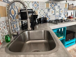 Fridge, microwave, stovetop, coffee/tea maker