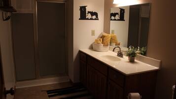 Shower, towels, soap, toilet paper