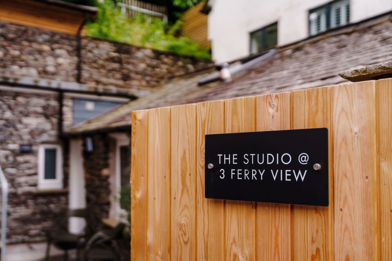 A wooden sign with 'THE STUDIO @ 3 FERRY VIEW' indicating the location.