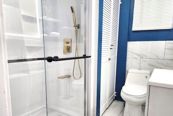 Shower, hair dryer, towels, soap