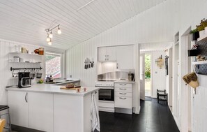 Fridge, stovetop, dishwasher, coffee/tea maker