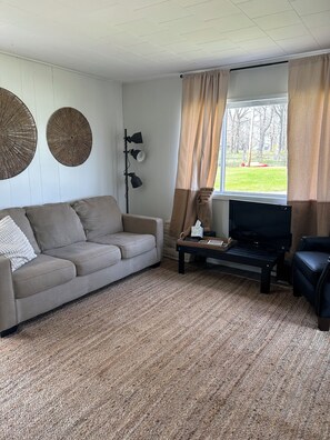 Living area - Welcoming  Lake Huron Cowboy Cottage with AC,  kayaks,  & more in Tawas (Tawas City)
