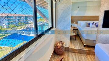Premium Apartment, Multiple Beds, Resort View | Desk, laptop workspace, blackout drapes, soundproofing