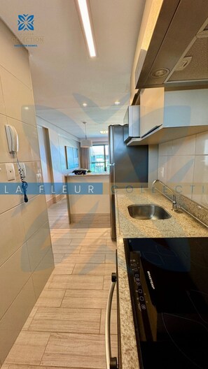 Family Apartment | Private kitchen | Fridge, microwave, highchair, cookware/dishes/utensils