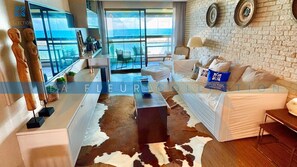 Deluxe-Apartment, Mehrere Betten, Meerblick | Wohnbereich