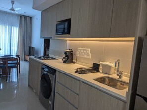 Fridge, microwave, stovetop, coffee/tea maker
