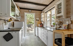 Fridge, stovetop, dishwasher, coffee/tea maker