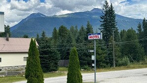 A motel sign with a mountain backdrop. - Blue River Motel (Blue River)