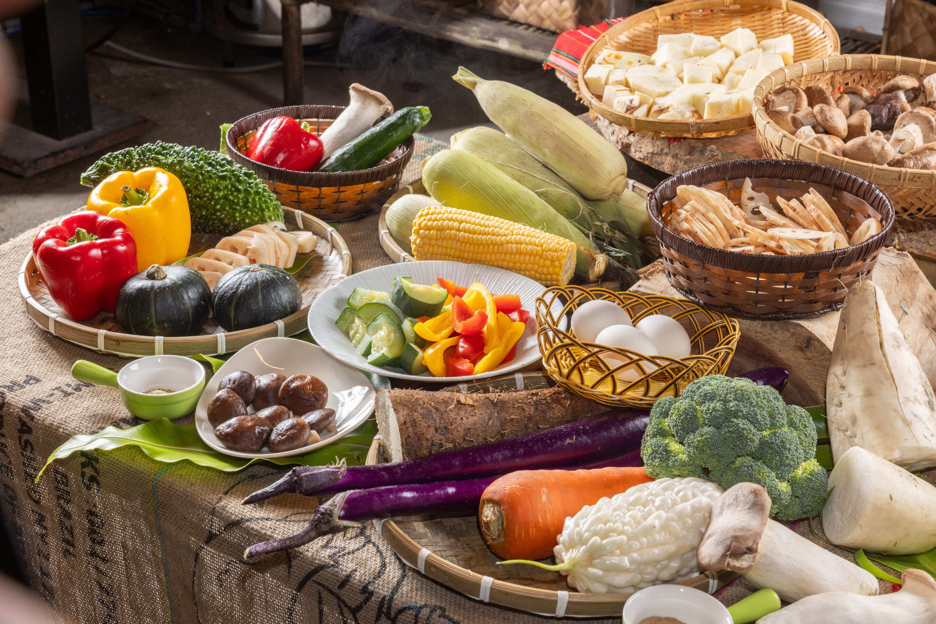 A variety of fresh vegetables and fruits displayed on a table.